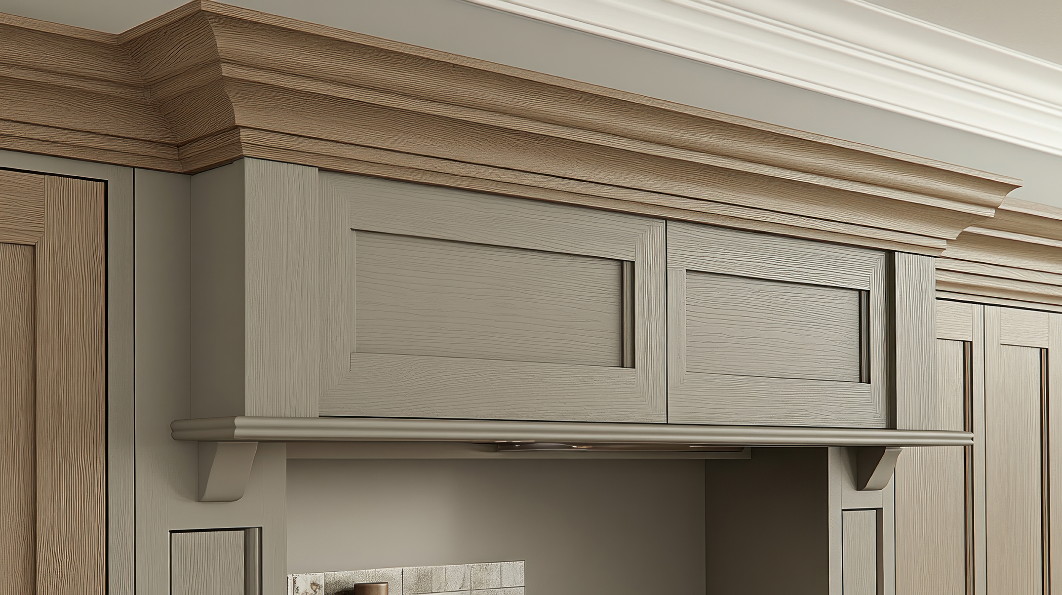 A light gray kitchen cabinet with double doors and crown molding, showcasing decorative details.