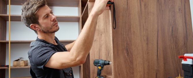 A cabinet maker adjusts the finishing touches on an installation. True North Cabinetry is ready to help you fulfill your vision and create custom cabinets.